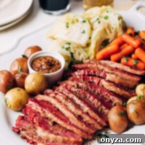 instant pot corned beef served with cabbage, carrots, and potatoes