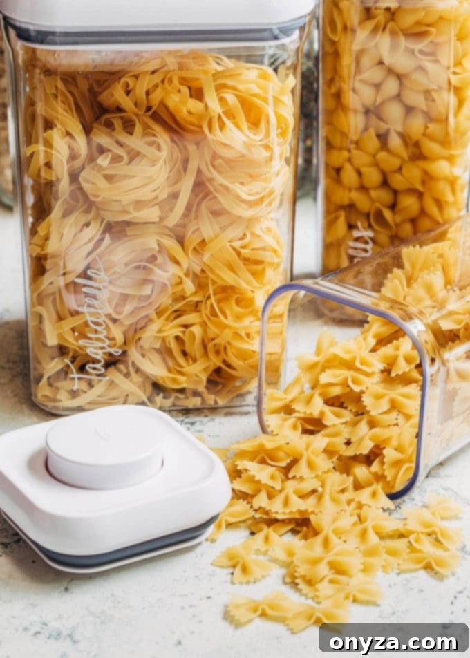 Stress-Free Pantry Organization You'll Love 3 dried pasta in OXO pop top plastic canisters