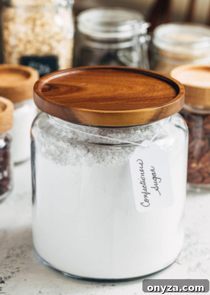 Stress-Free Pantry Organization You'll Love 6 glass pantry storage containers with powdered sugar and dry goods