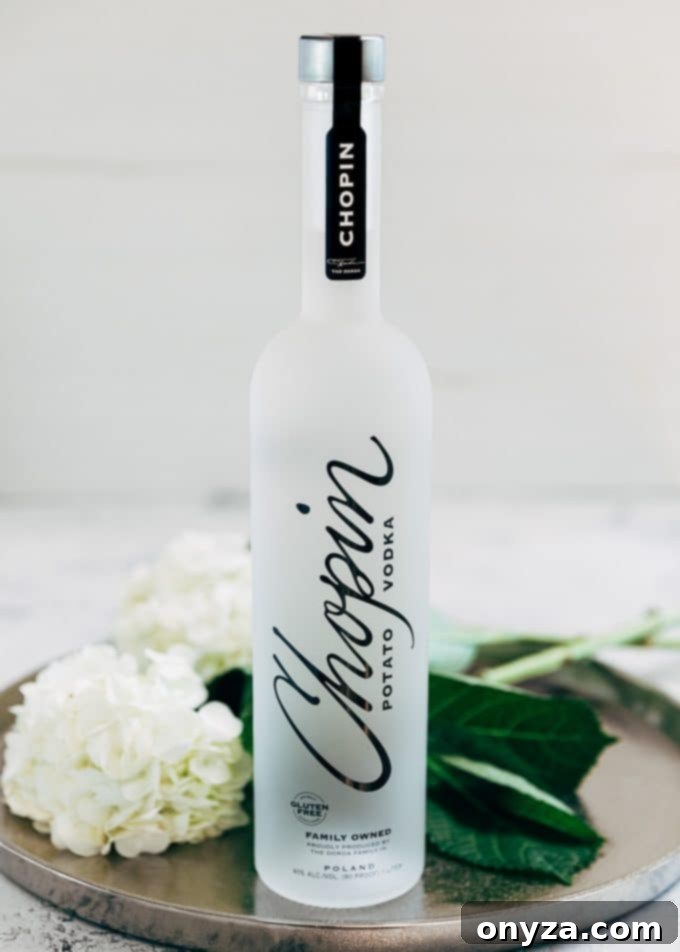 Bottle of Chopin Potato Vodka on a tray adorned with hydrangeas
