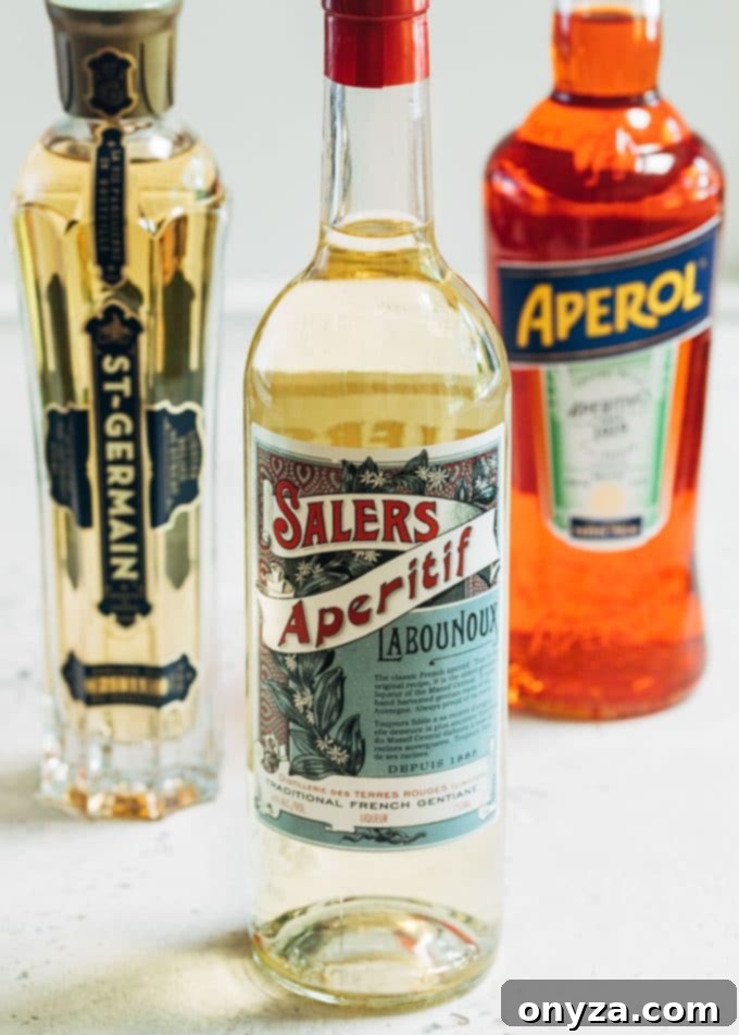 Bottles of St-Germain elderflower liqueur, Salers Gentiane Apéritif, and Aperol bitter aperitif