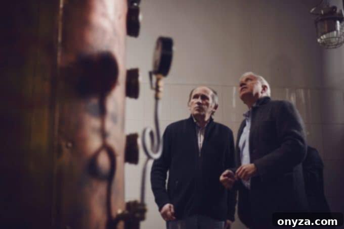 Tad Dorda alongside Chopin's Master Distiller, emphasizing the hands-on quality of Polish vodka production.