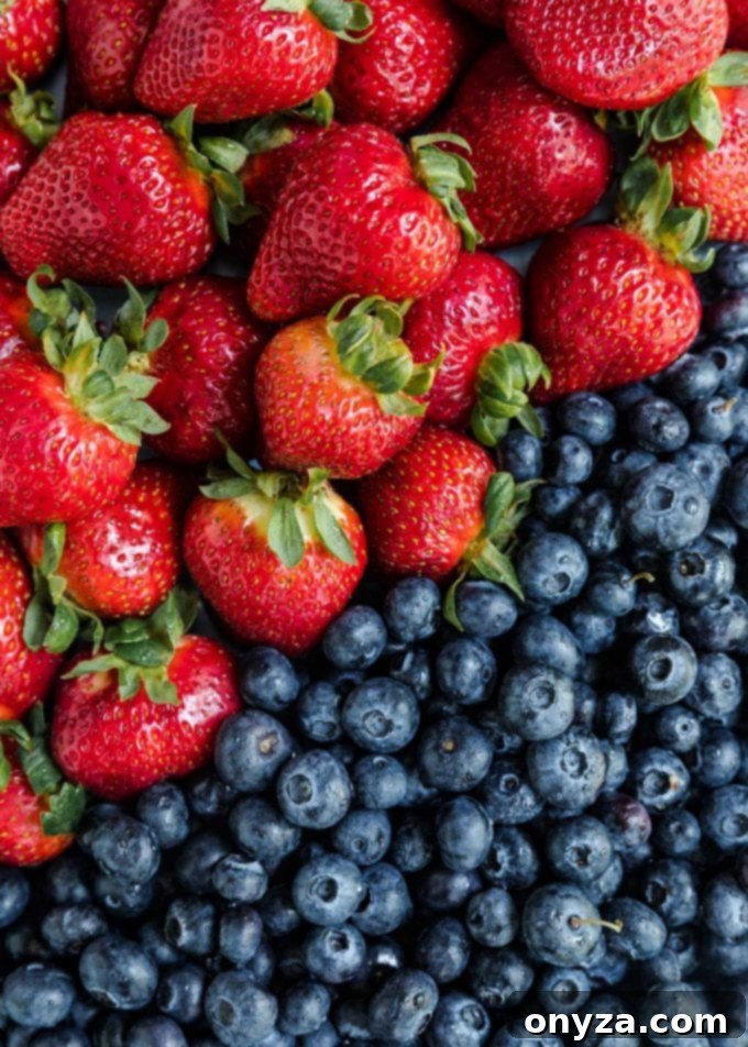 Fresh California Giant Berry Farms Strawberries and Blueberries, key ingredients for a vibrant salad