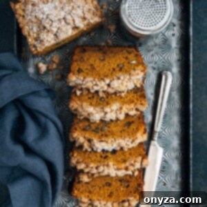 Streusel topped pumpkin bread on a baking sheet, ready for serving