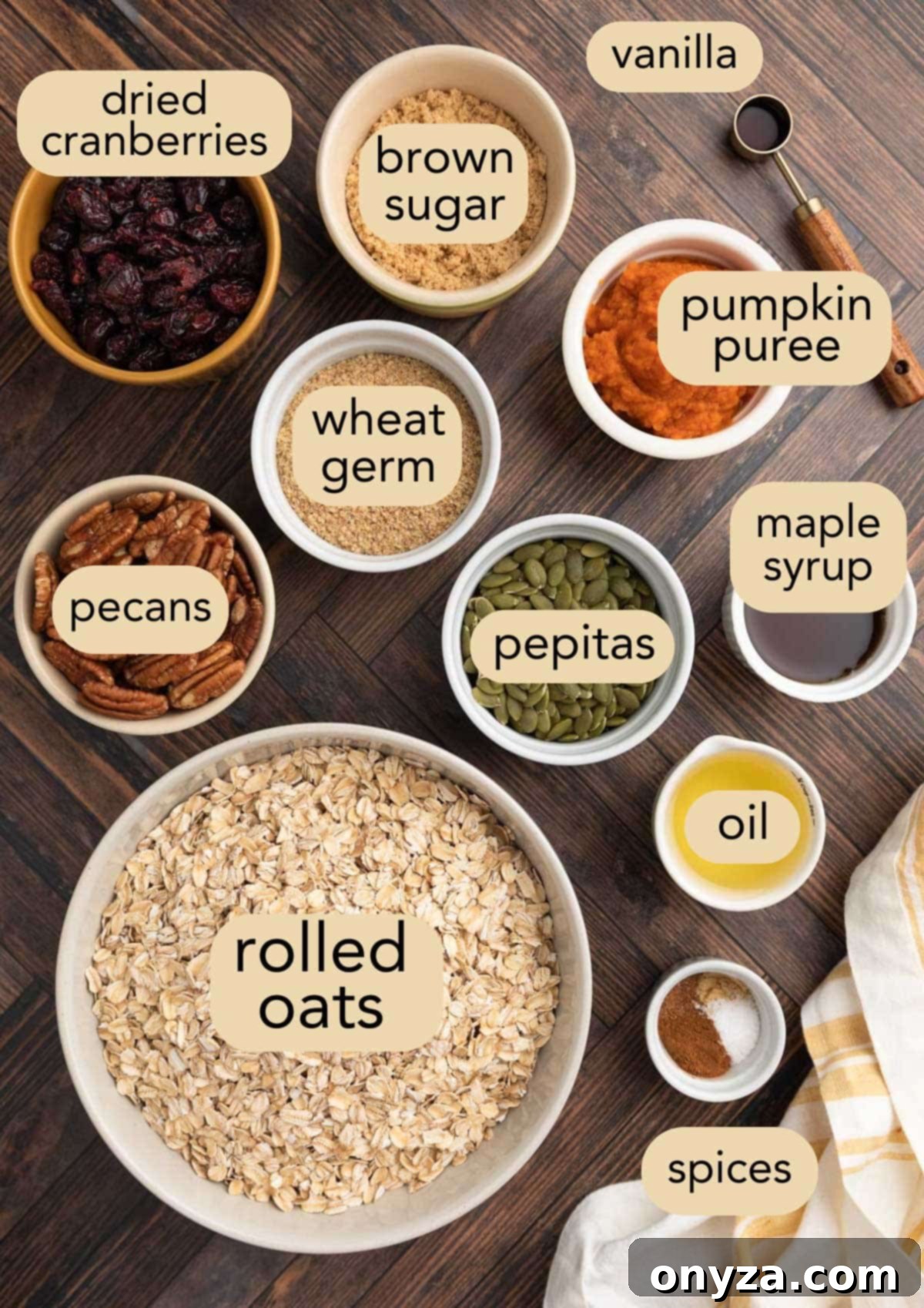 Ingredients needed to make Pumpkin Granola, neatly arranged in bowls on a wooden background, showcasing fresh, high-quality components.