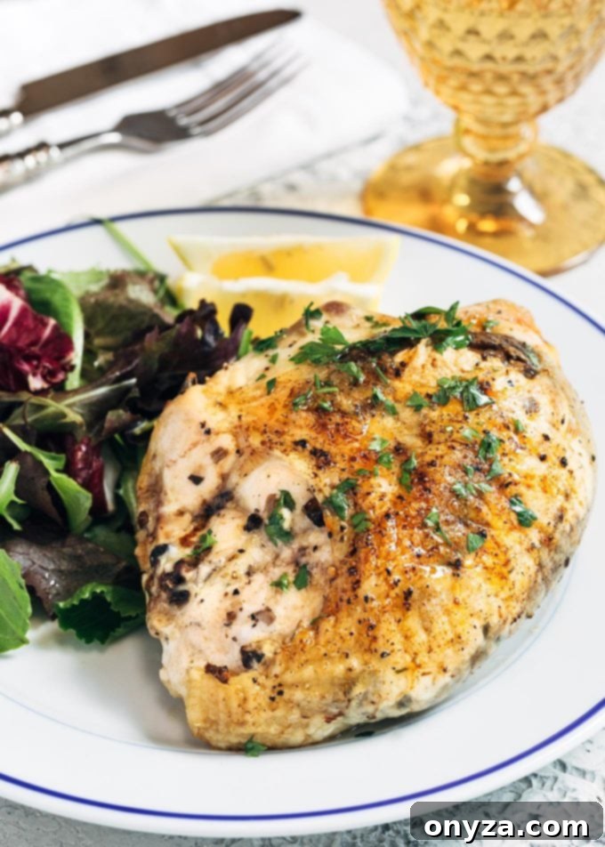 Perfectly baked stuffed chicken breast revealing a rich mushroom and goat cheese filling