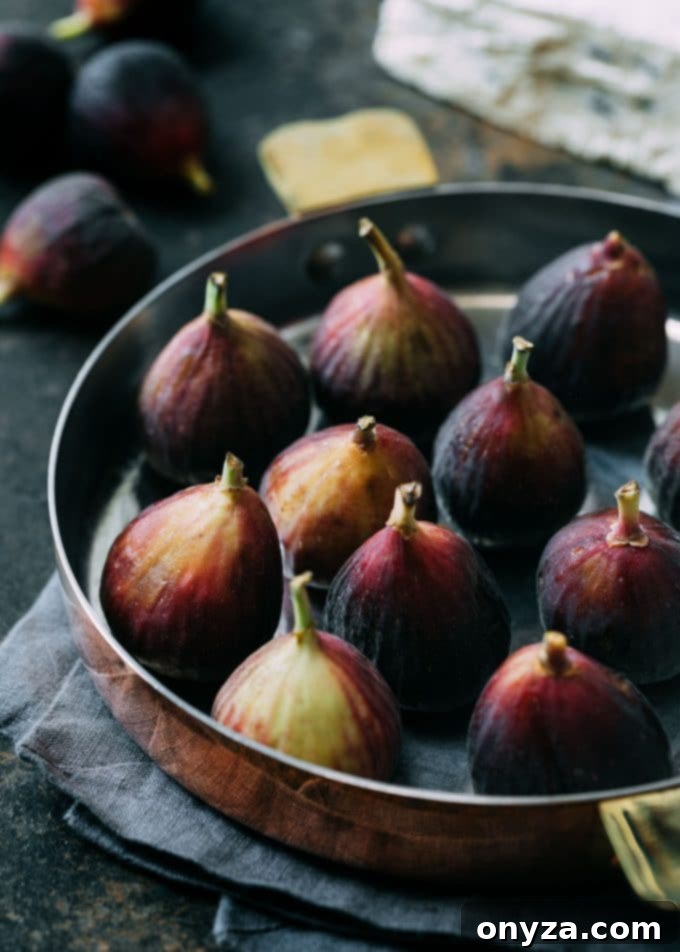 Fresh Brown Turkey figs in a rustic copper baking dish, ready for stuffing