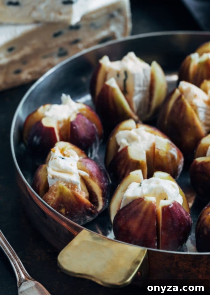 Unbaked Brown Turkey figs, meticulously stuffed with cubes of creamy Cambozola cheese