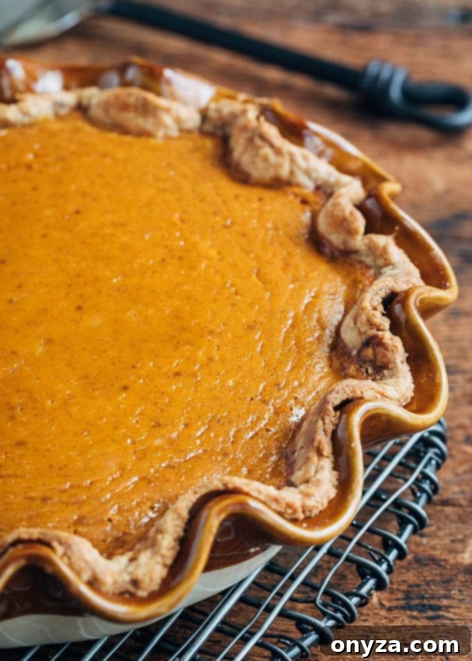 Velvet Pumpkin Custard Pie 4 baked pumpkin pie on a cooling rack