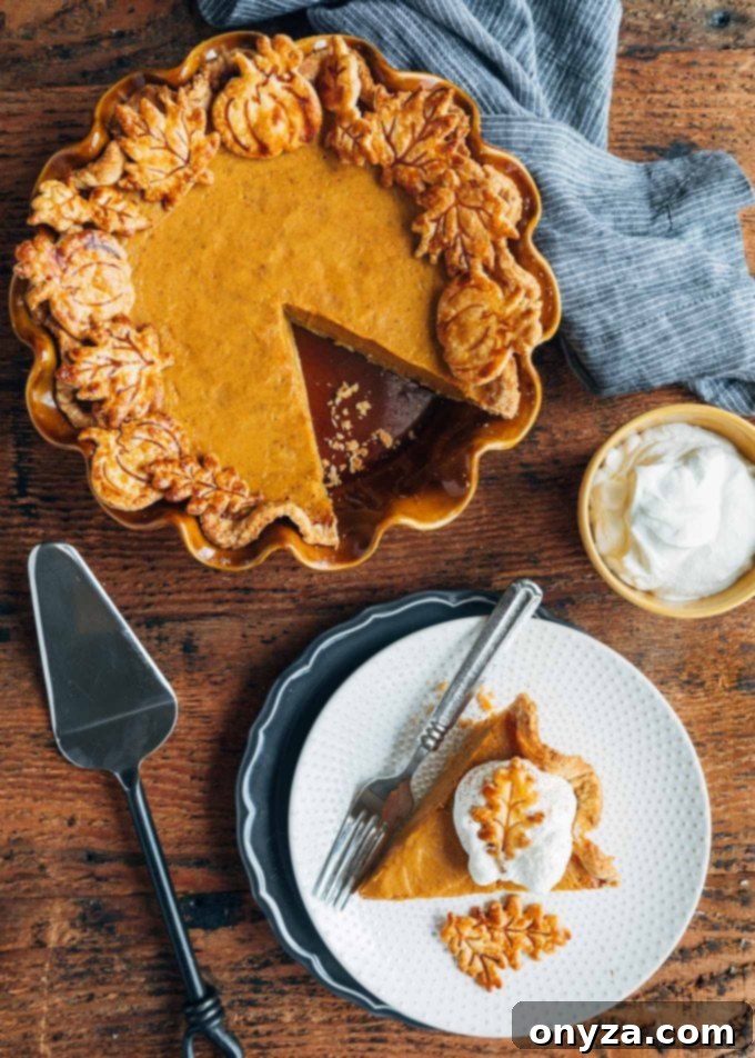 Velvet Pumpkin Custard Pie 5 slice of pumpkin pie on a plate and a whole pie with a slice missing