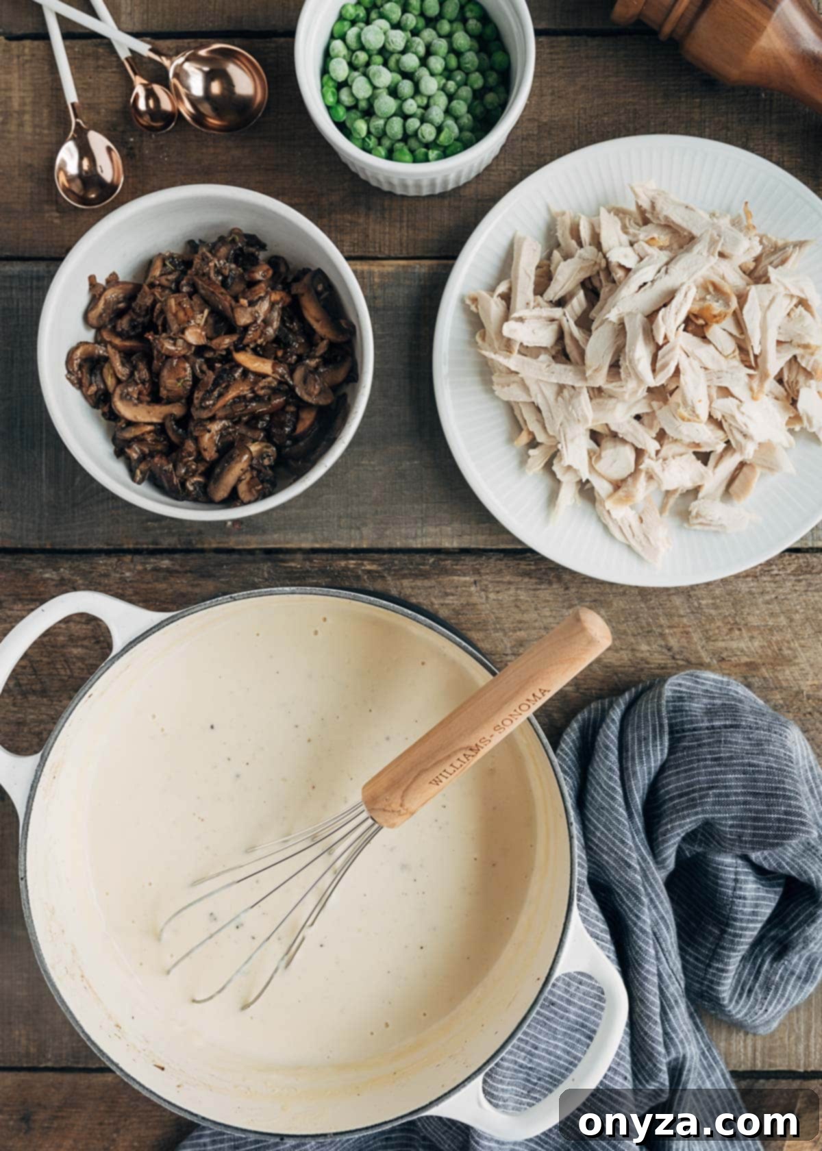 Creamy Turkey Tetrazzini 3 pot of bechamel sauce, shredded turkey, sauteed onions, and frozen peas