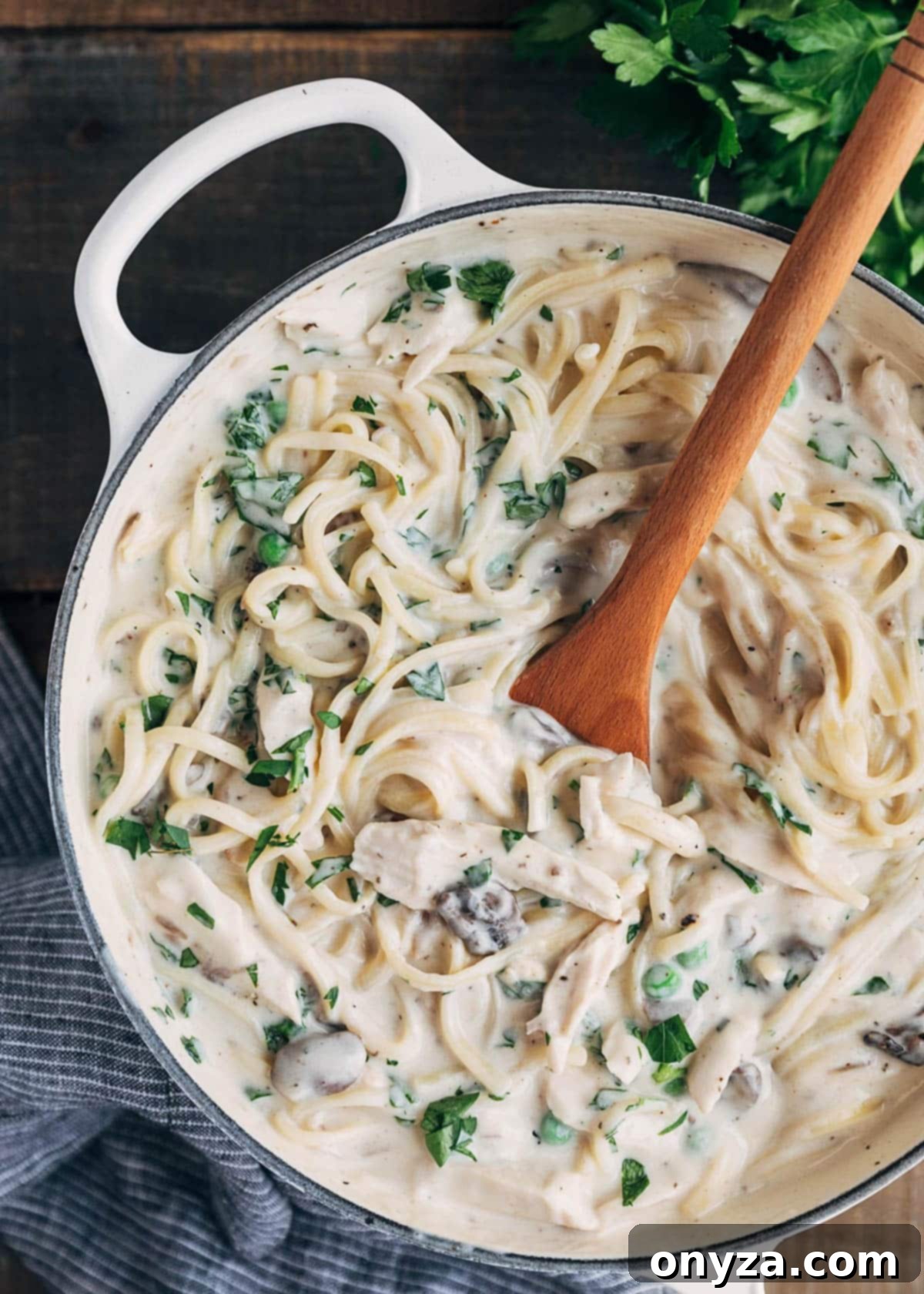 Creamy Turkey Tetrazzini 4 unbaked turkey tetrazzini with linguine noodles in a pot