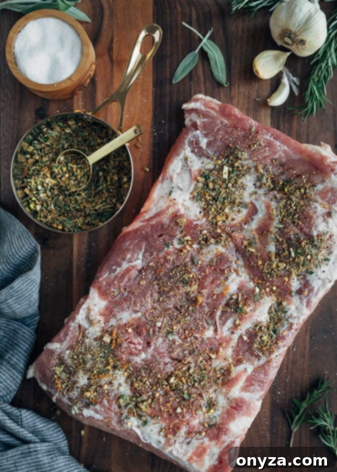 Perfectly Crispy Porchetta 4 Pork belly rubbed with spices for porchetta, ready for rolling.