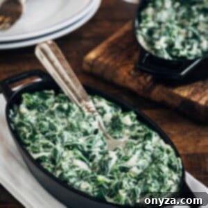 creamed spinach in a cast iron gratin with a spoon