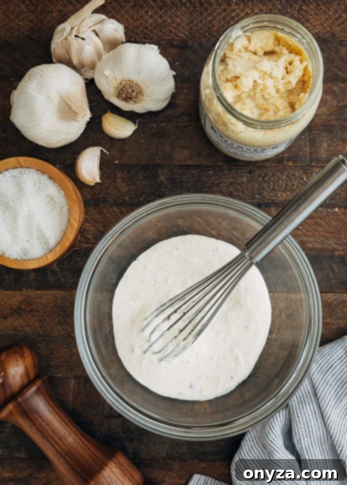 Unrivaled Steak Sandwich 2 Bowl of freshly made horseradish aioli with a whisk