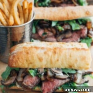 Unrivaled Steak Sandwich 6 Gourmet steak sandwiches with horseradish mayo on a wood board