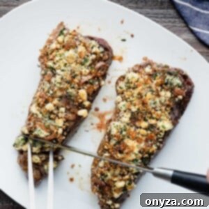 Balsamic Shallot Steak with Blue Cheese Crust 10 slicing blue cheese crusted steak on a white serving platter