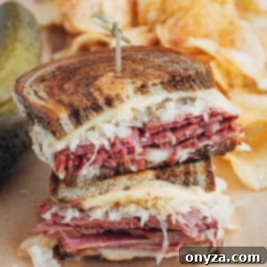 Homemade Reuben Sandwich Perfection 6 Stacked halves of a grilled Reuben sandwich with potato chips