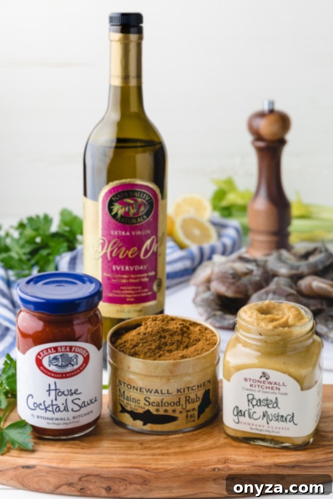 Signature Roasted Shrimp with Duo Dips 2 An array of high-quality Stonewall Kitchen products, including sauces and seasonings, essential for crafting a gourmet roasted shrimp cocktail at home.