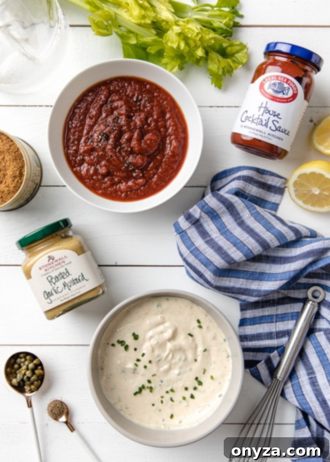 Signature Roasted Shrimp with Duo Dips 3 Elegant bowls of Bloody Mary cocktail sauce and roasted garlic remoulade, flanked by an assortment of Stonewall Kitchen jars, showcasing premium dipping options.