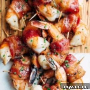 bourbon glazed bacon wrapped shrimp on a serving board
