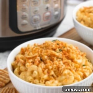 Instant Pot Mac and Cheese Four Irresistible Styles 11 instant pot macaroni and cheese in a white bowl with crushed cheese crisps