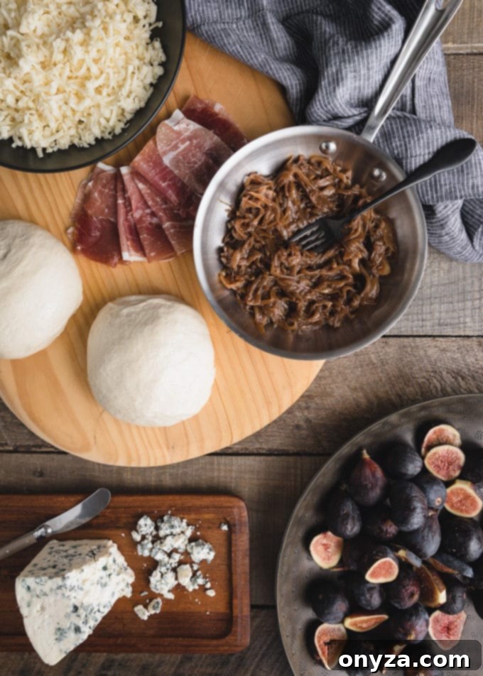 overhead view of ingredients to make gorgonzola and fig pizza