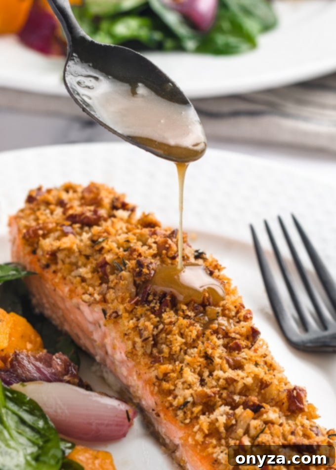 drizzling maple bourbon glaze over salmon