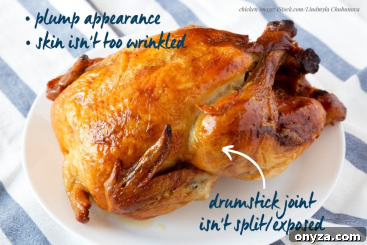 cooked rotisserie chicken on a white plate on top of a blue napkin with text overlays that read 