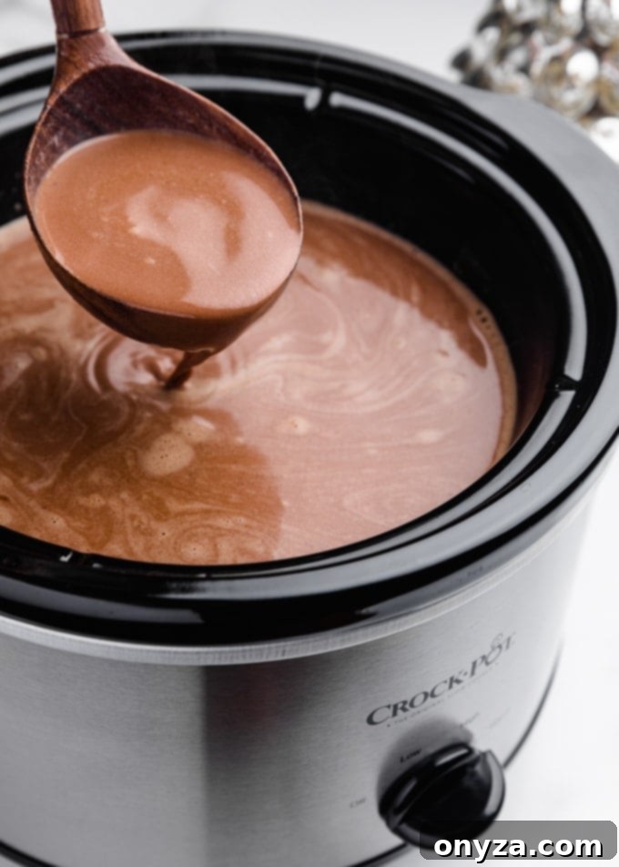 hot chocolate being ladled from a slow cooker
