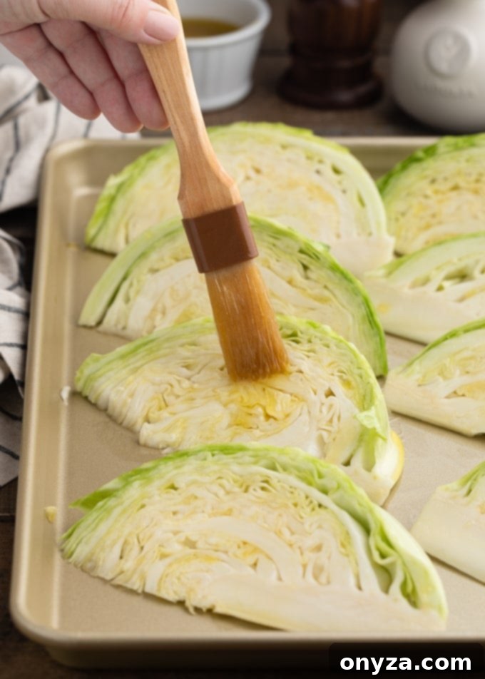 brushing green cabbage wedges with olive oil