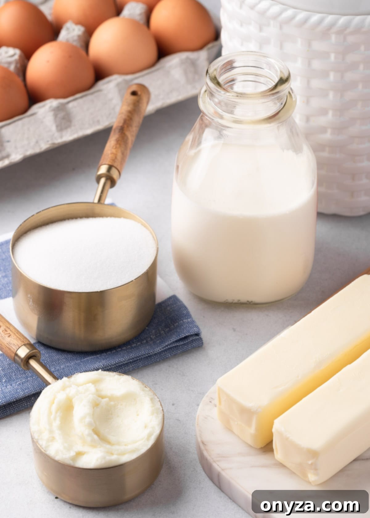 ingredients for vanilla pound cake: eggs, half and half, sugar, shortening, and butter