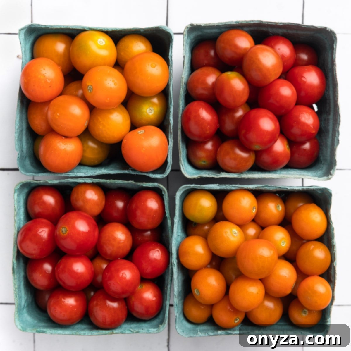 Garlic Herb Cherry Tomato Confit 3 overhad of four pints of orange, yellow, and red cherry tomatoes