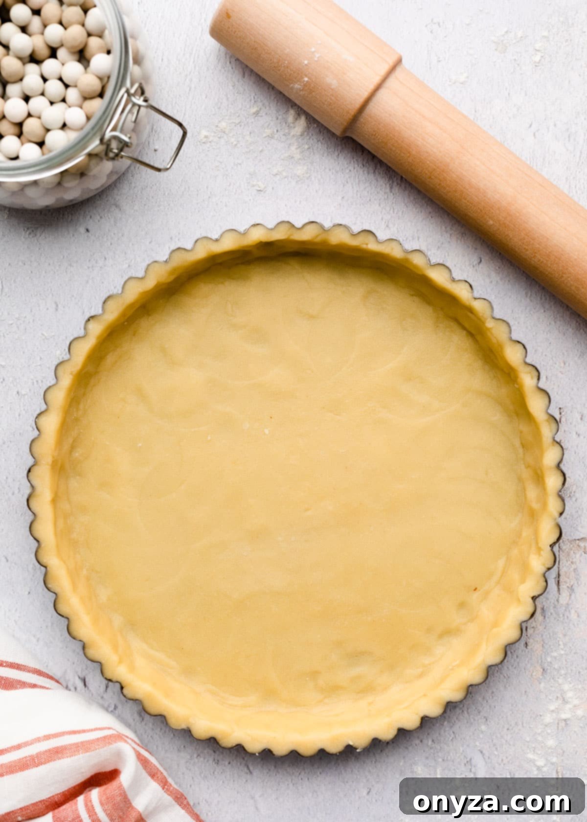 unbaked pate sablee in a tart pan