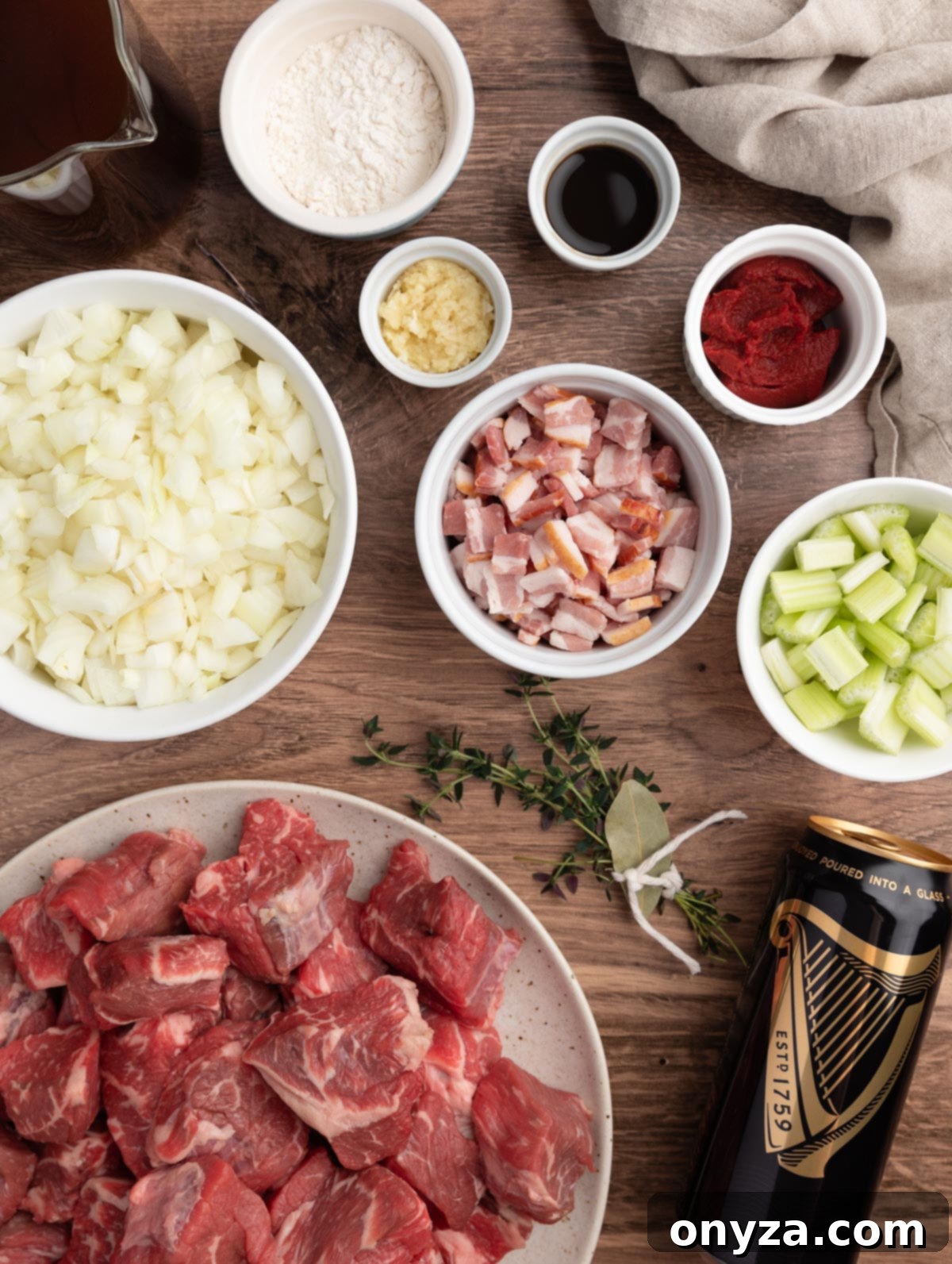 Slow-Cooked Guinness Beef Stew 3 overhead photo showing the ingredients needed to make guinness beef stew in bowls