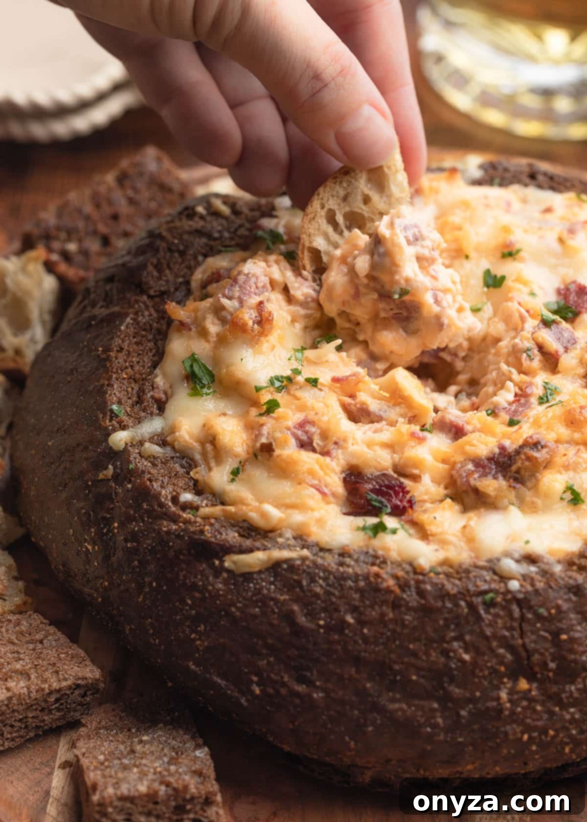 Irresistible Reuben Dip 9 reuben dip in a bread bowl dipped with a rye bread dipper