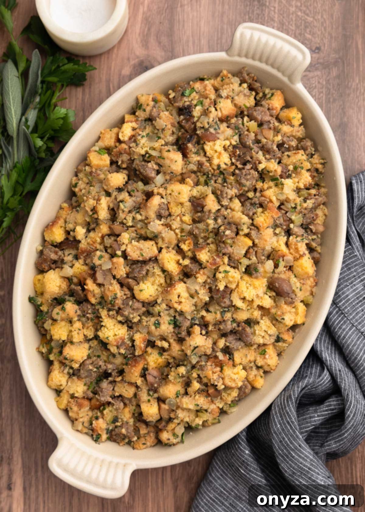 Festive Sausage and Chestnut Stuffing 15 overhead of unbaked sausage and chestnut stuffing in an oval gratin pan