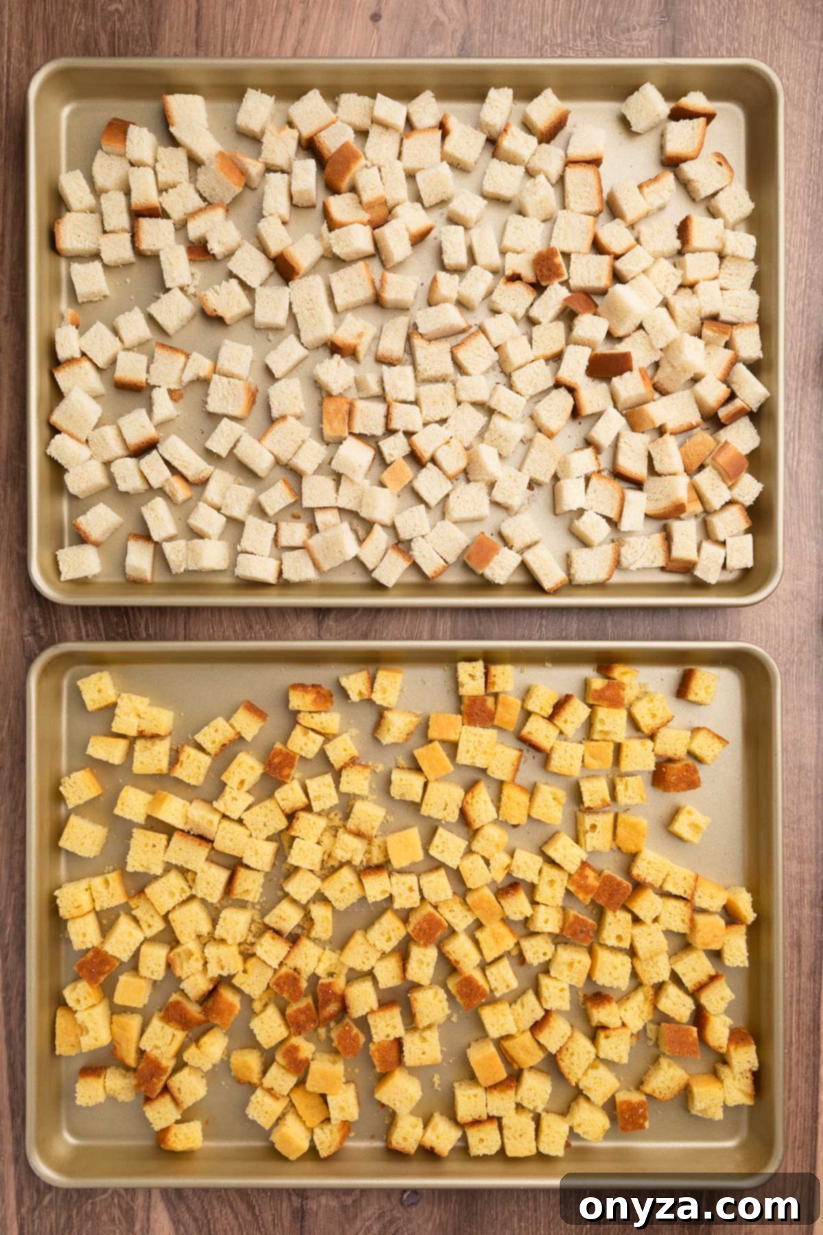 Festive Sausage and Chestnut Stuffing 5 two rimmed sheet pans with country white bread cubes (top) and cornbread cubes (bottom)