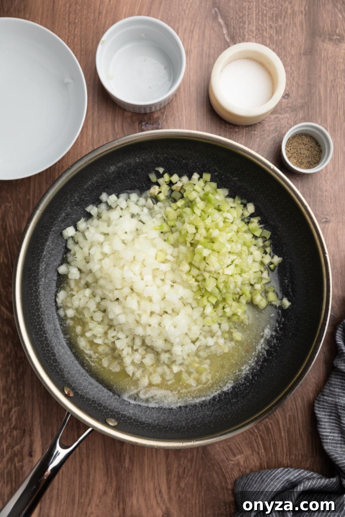 Festive Sausage and Chestnut Stuffing 9 raw diced onions and celery in a skillet with melted butter