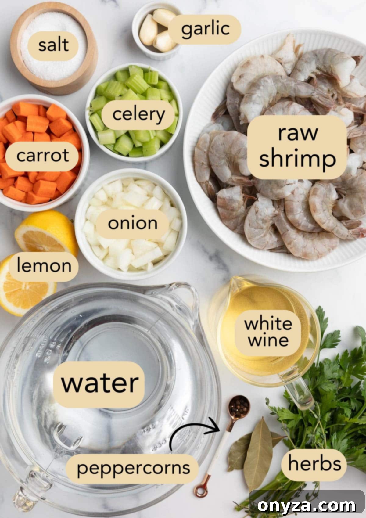 Overhead photo showcasing all the fresh ingredients needed to prepare poached shrimp in a court bouillon, neatly arranged in bowls on a pristine white marble board.