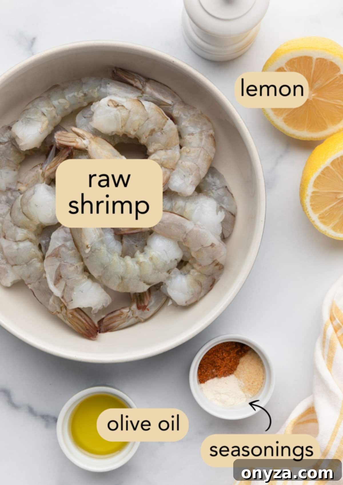 Crispy Air Fryer Shrimp 3 raw shrimp, olive oil, and ground spices in bowls next to a halved lemon. Ingredients have text label overlays.