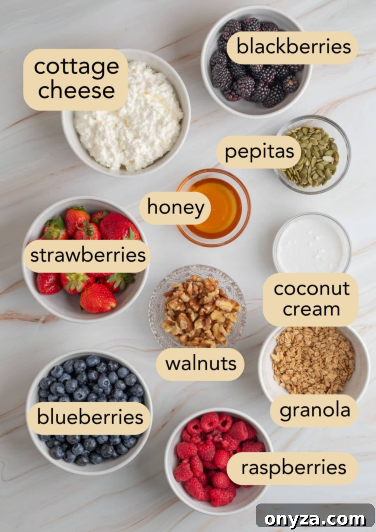 Blueberry Protein Smoothie Bowls 3 An overhead shot showcasing all the fresh ingredients required to prepare delicious berry blended cottage cheese bowls, clearly labeled for easy identification.