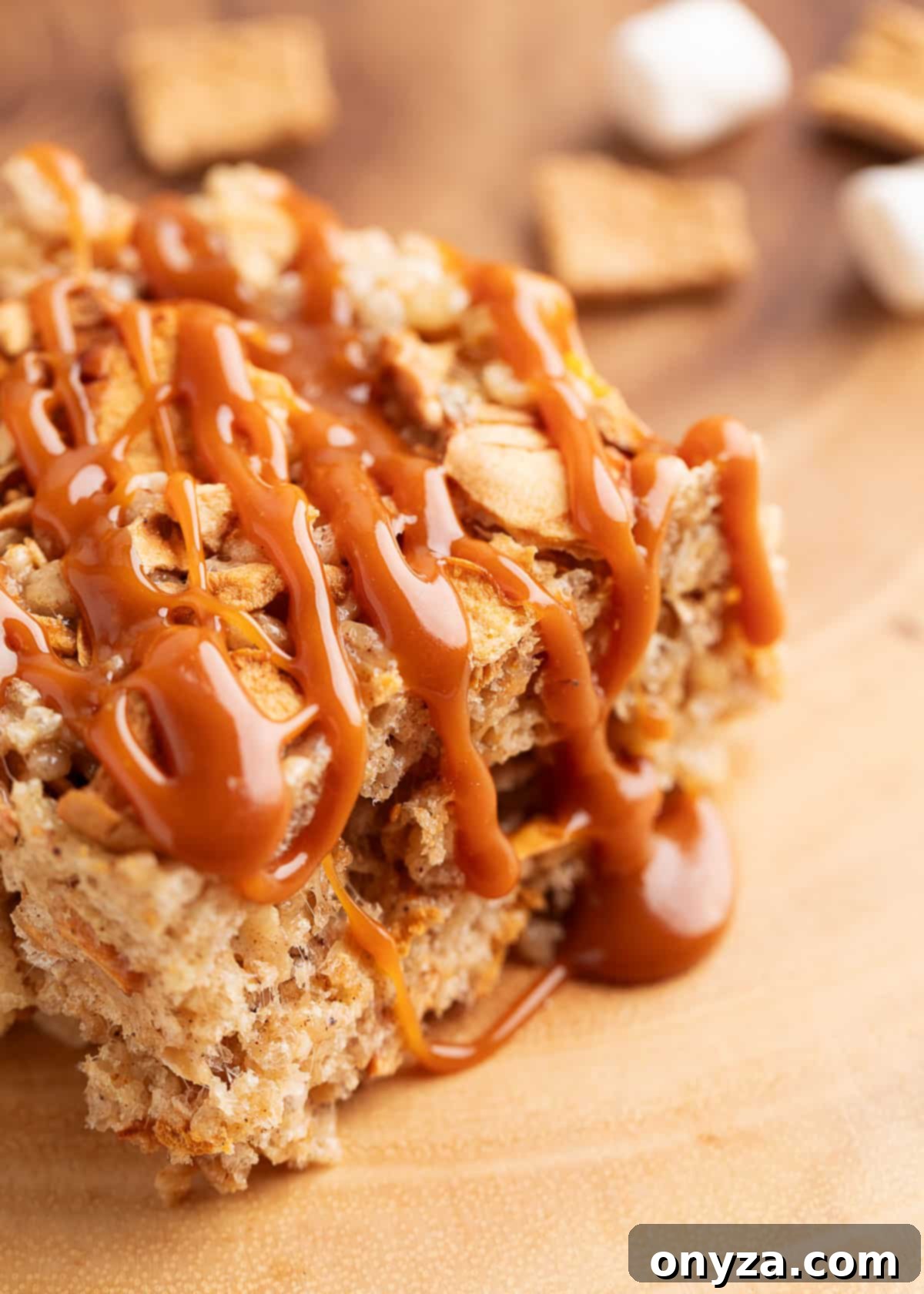 closeup of a caramel apple pie krispie treat on parchment