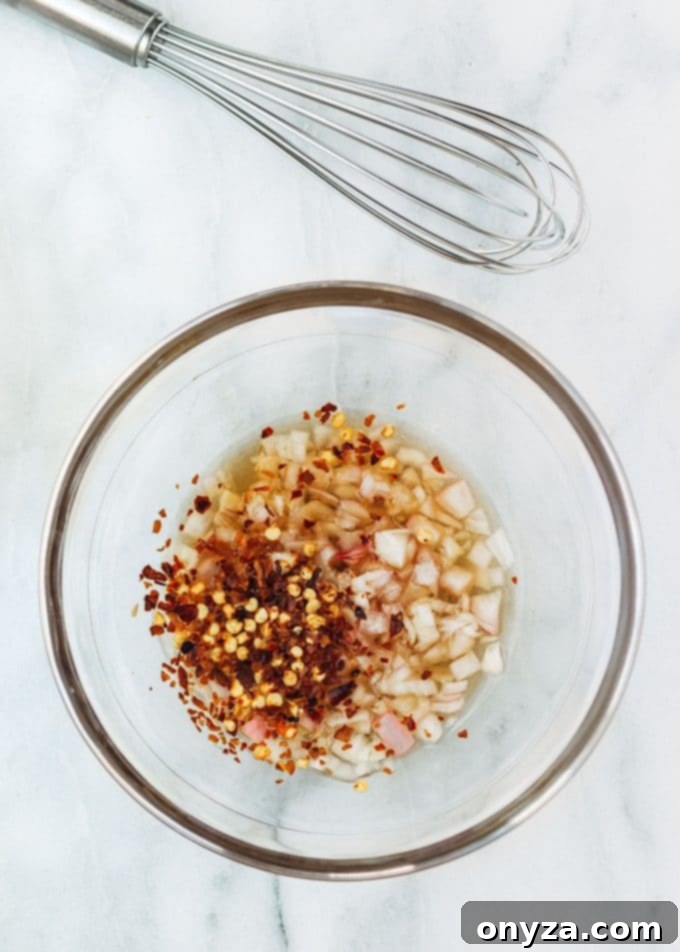 ingredients for brown butter apple cider vinaigrette in a mixing bowl
