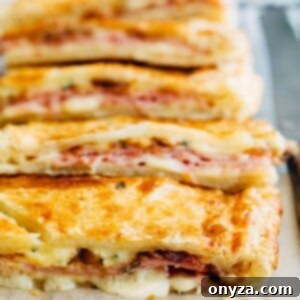 Golden Flaky Ham and Cheese Bake 2 sliced ham and cheese puff pastry slab pie