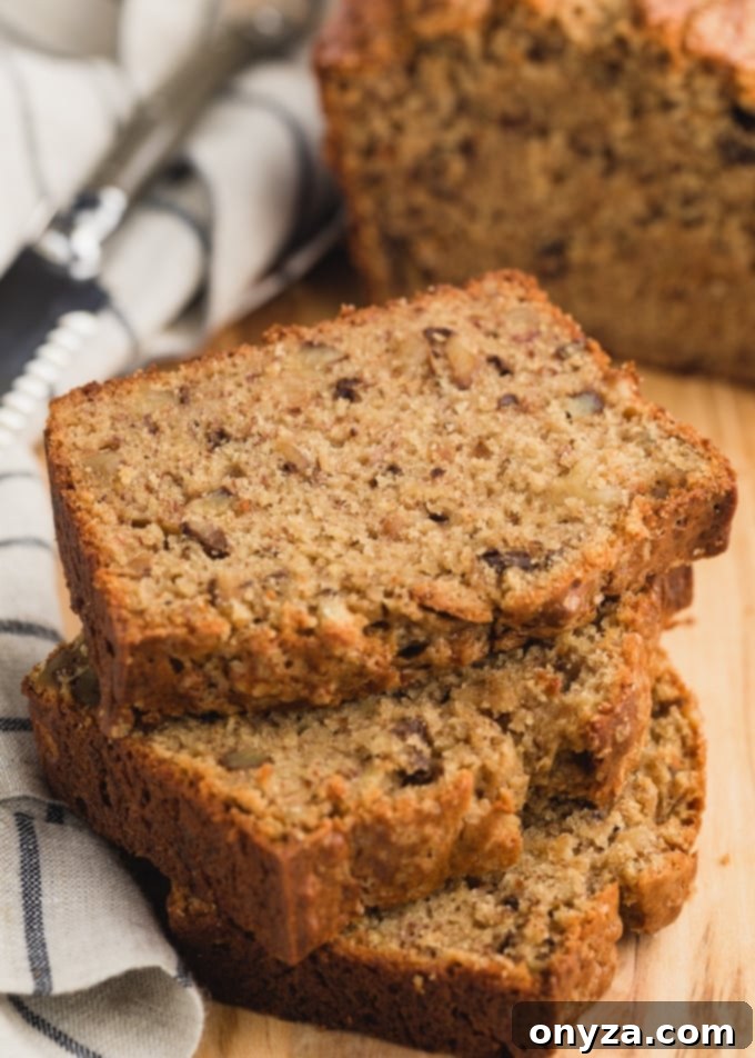 Delicious slices of brown butter sour cream banana bread arranged on a rustic wood board, ready to be served.