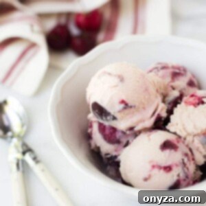 Scoops of rich rum cherry ice cream, ready to be served.