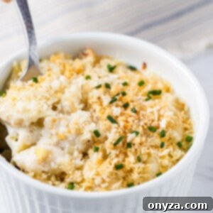 gorgonzola macaroni and cheese in a white ramekin with a spoon
