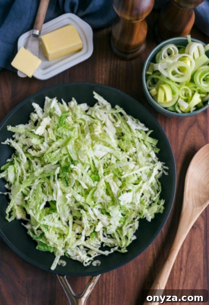 Shredded Savoy Cabbage | Striped Spatula Finely shredded Savoy cabbage ready to be sautéed in a pan for a delicious Colcannon recipe.