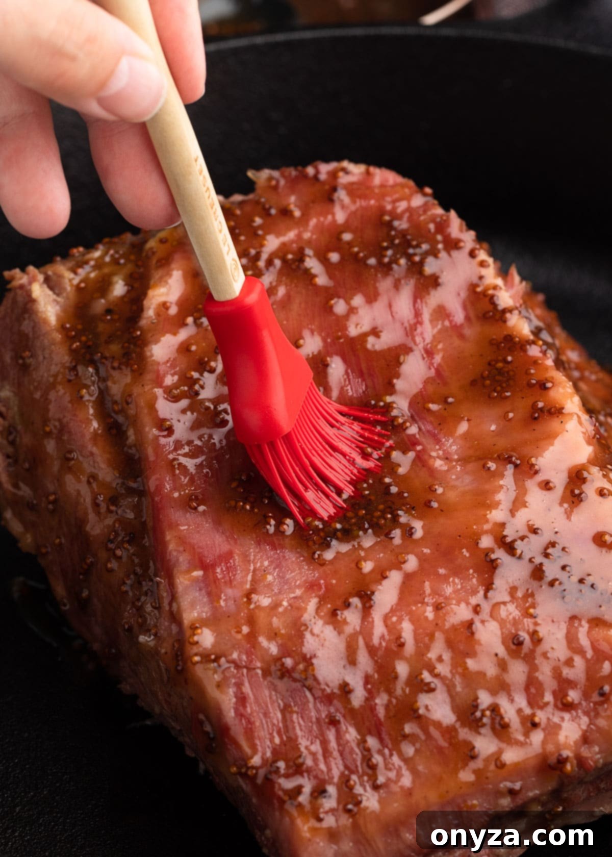 Golden Beer Braised Corned Beef Glazed with Whiskey Mustard 7 Brushing braised corned beef with whiskey mustard glaze